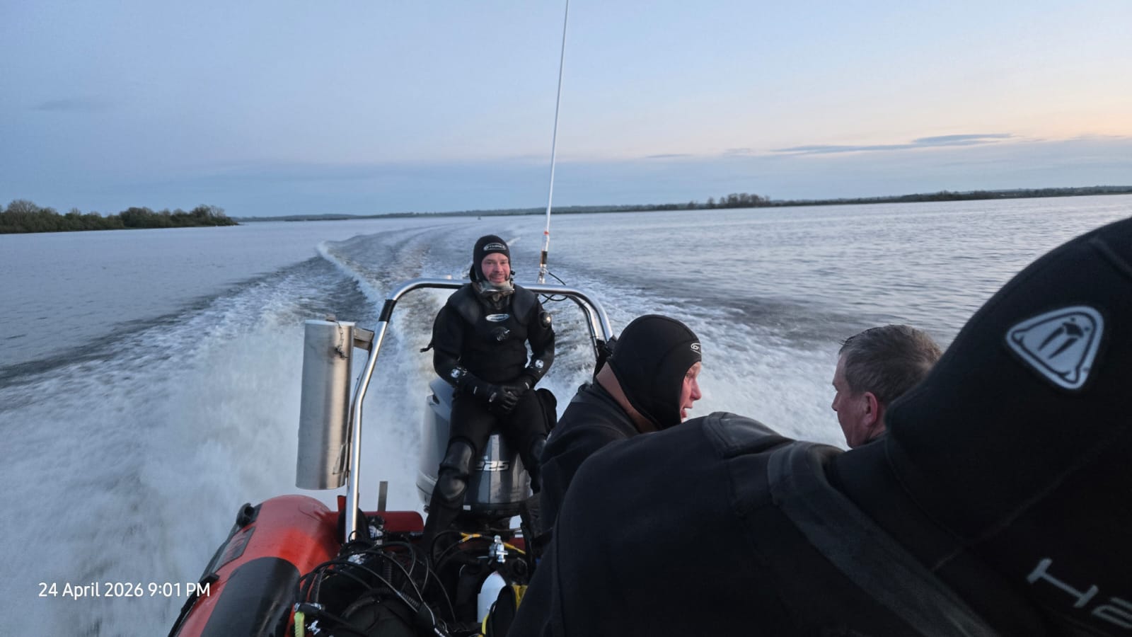 Lough Ree Sub Aqua Club members travelling by boat in diving gear
